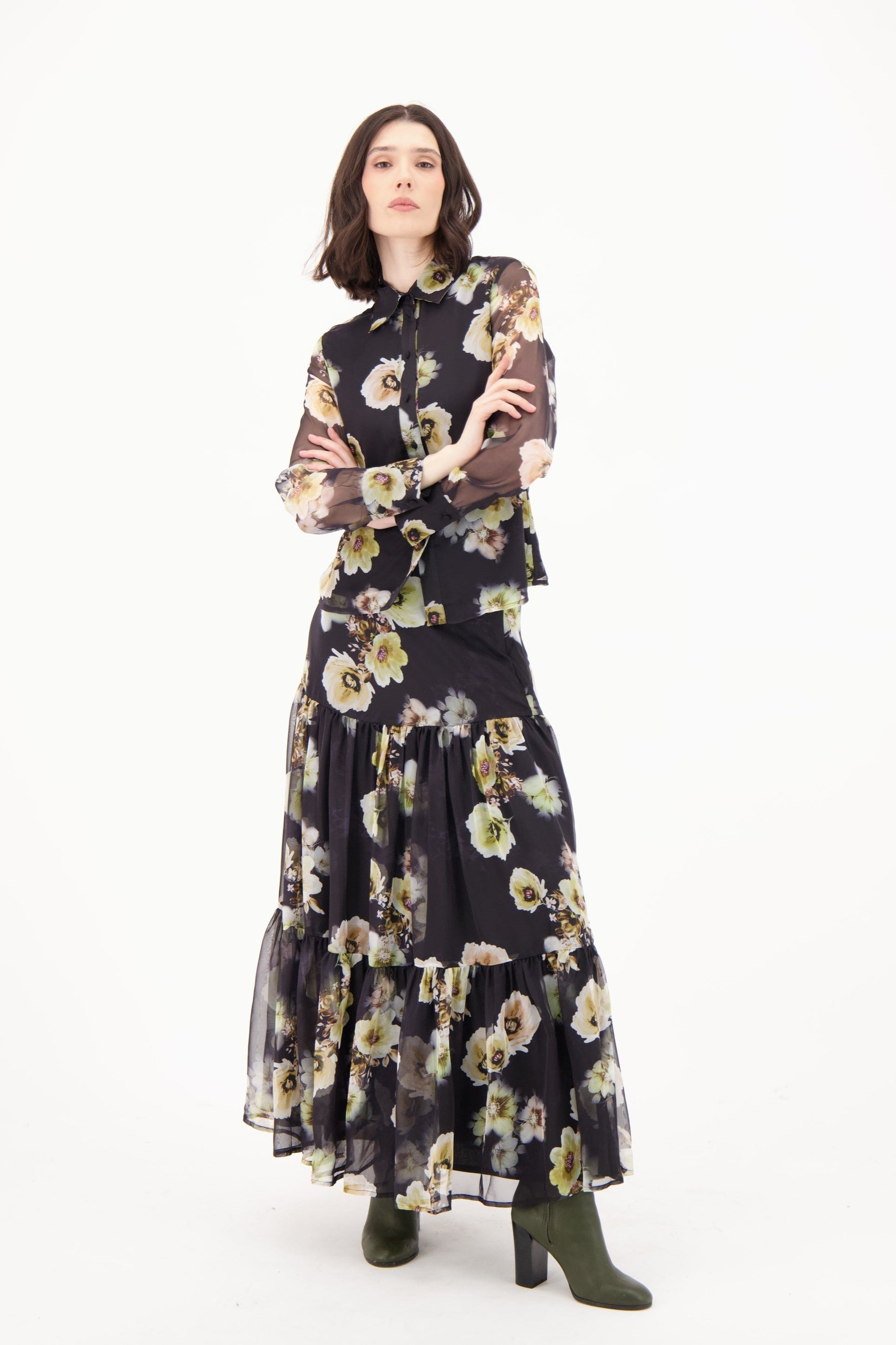 Woman wearing a floral dress on a white background