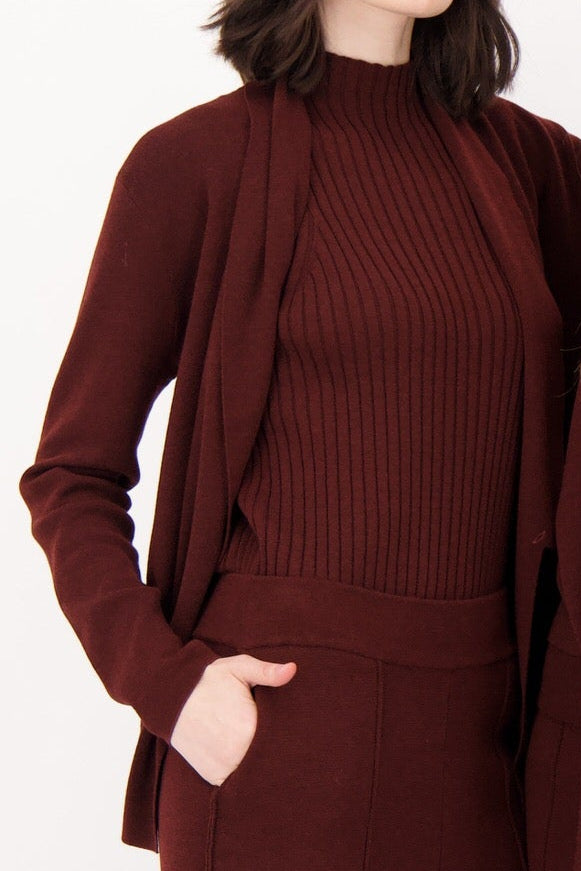 Maroon ribbed sweater and cardigan set on a white background