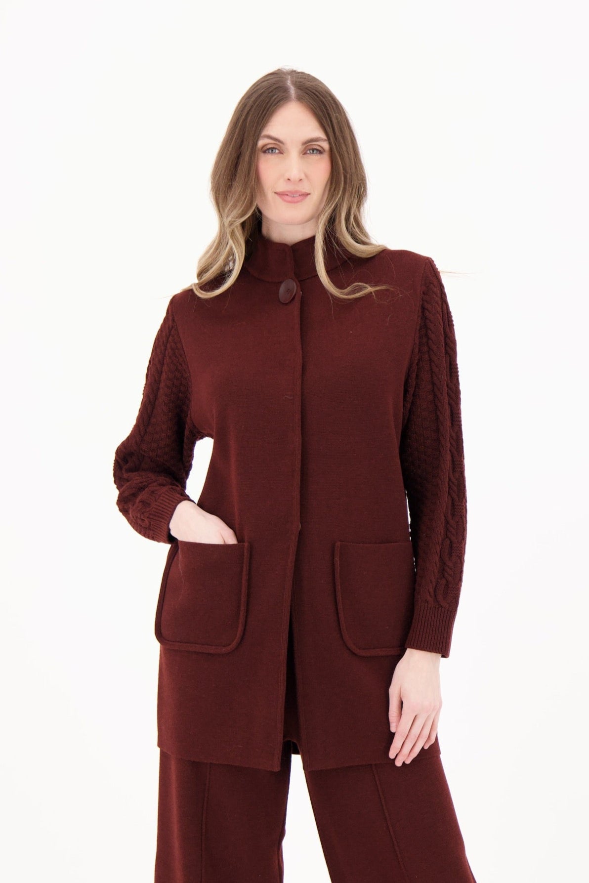 Woman wearing a brown suit on a white background