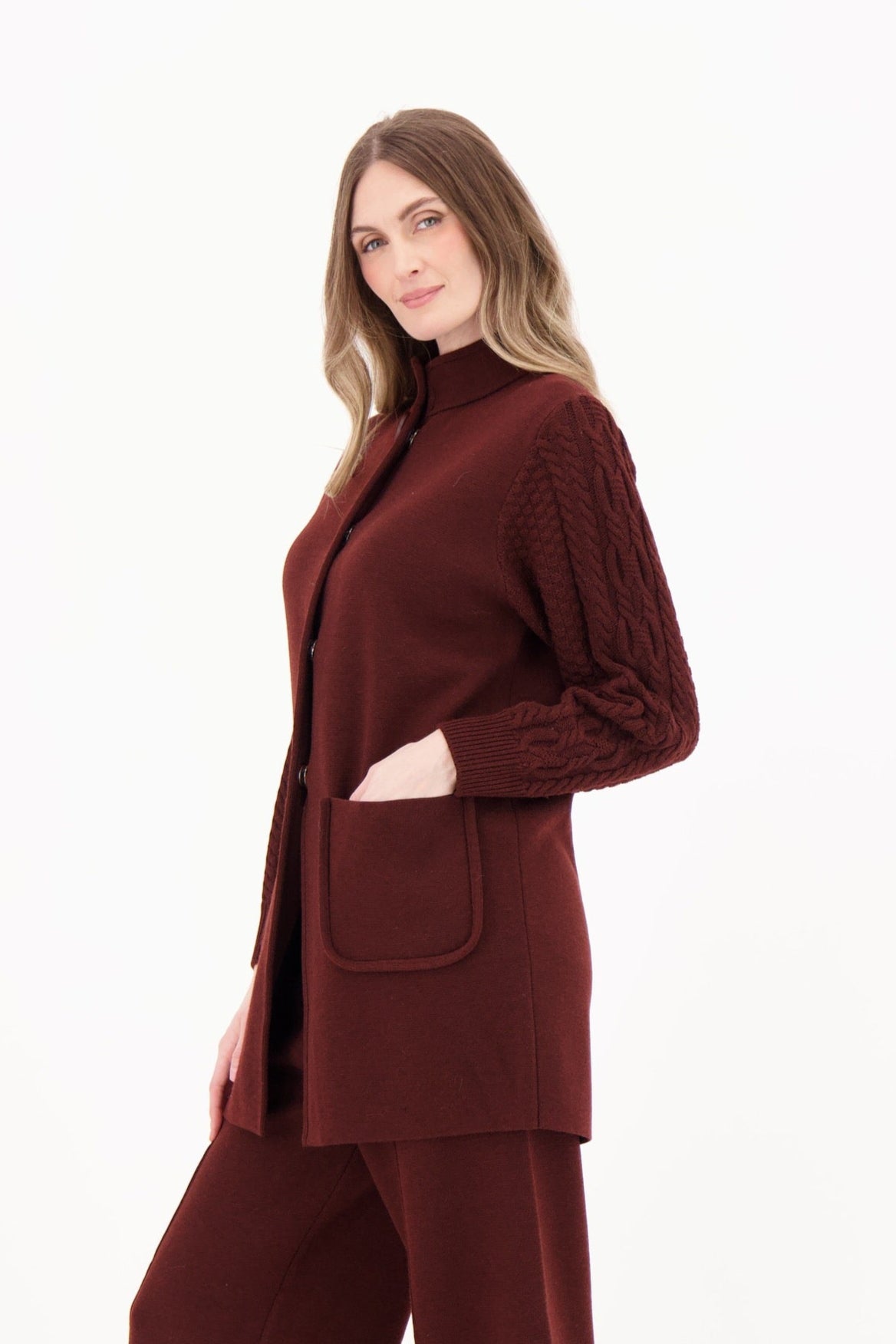 Woman wearing a brown suit on a white background