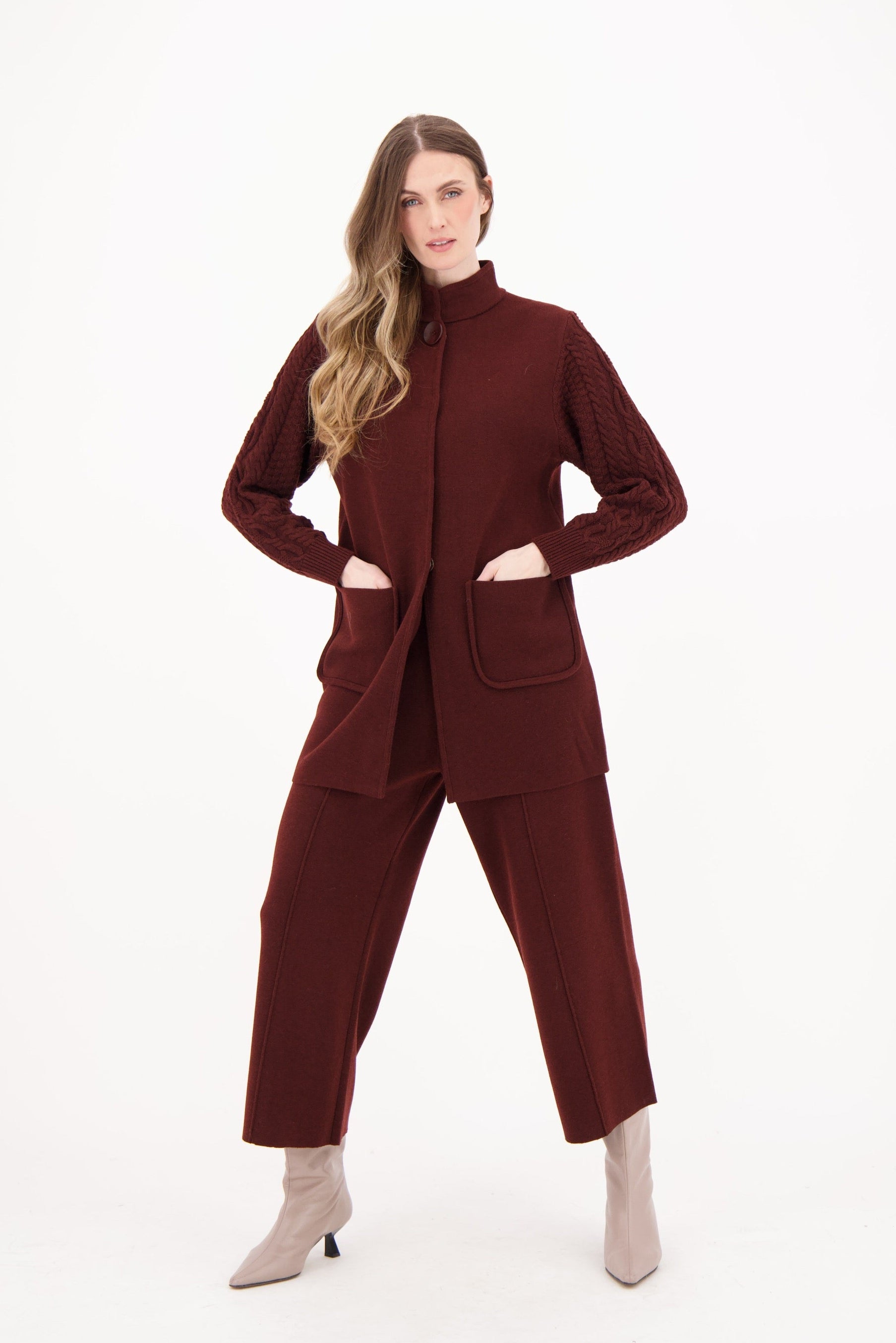 Woman wearing a brown suit on a white background