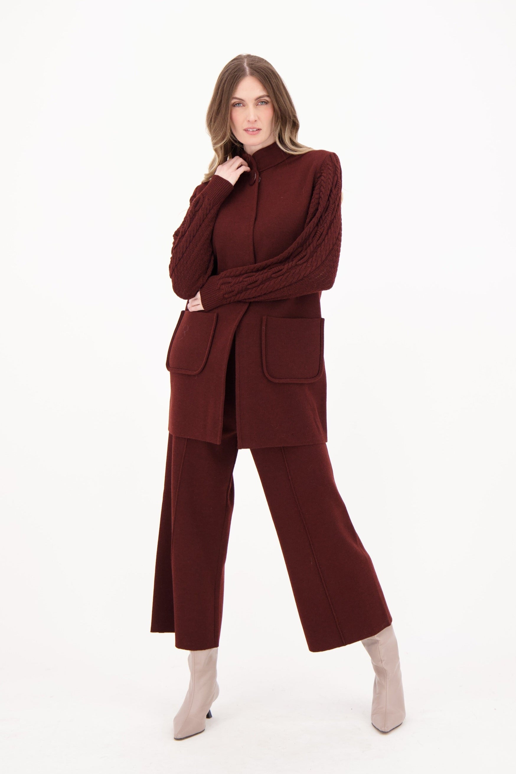 Woman wearing a burgundy outfit on a white background