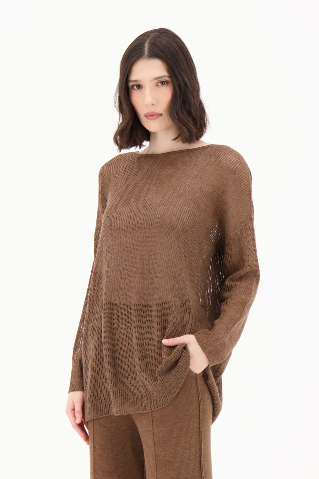 Woman wearing a brown outfit on a white background