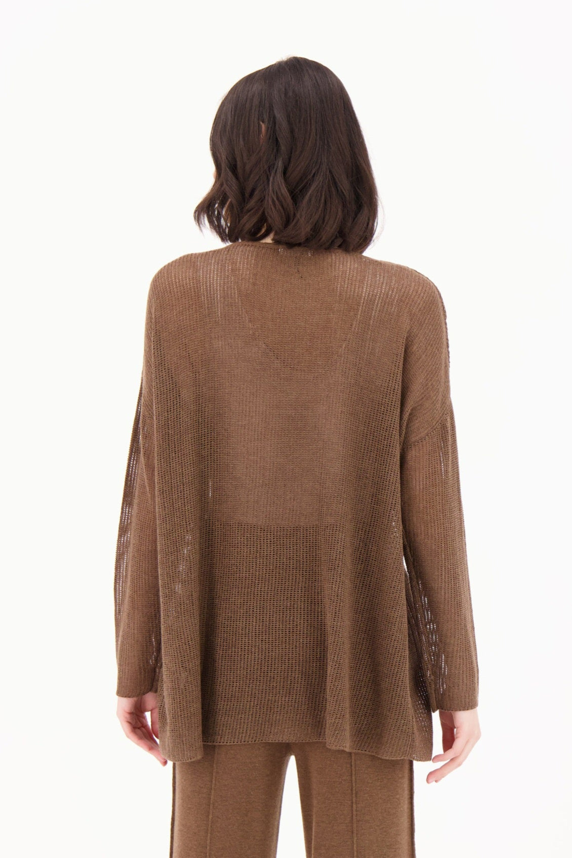 Person wearing a brown suit on a white background