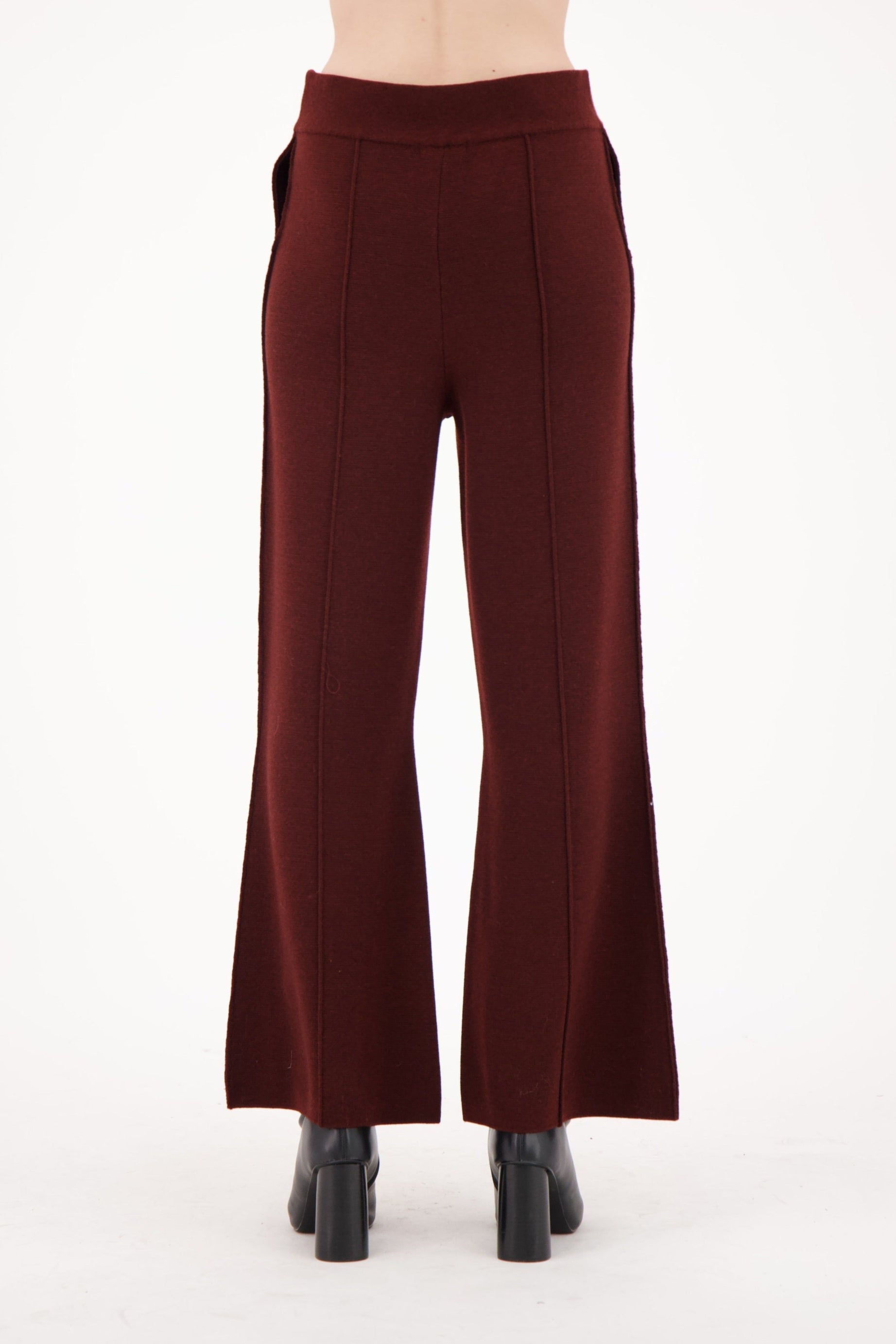 Maroon high-waisted pants on a white background