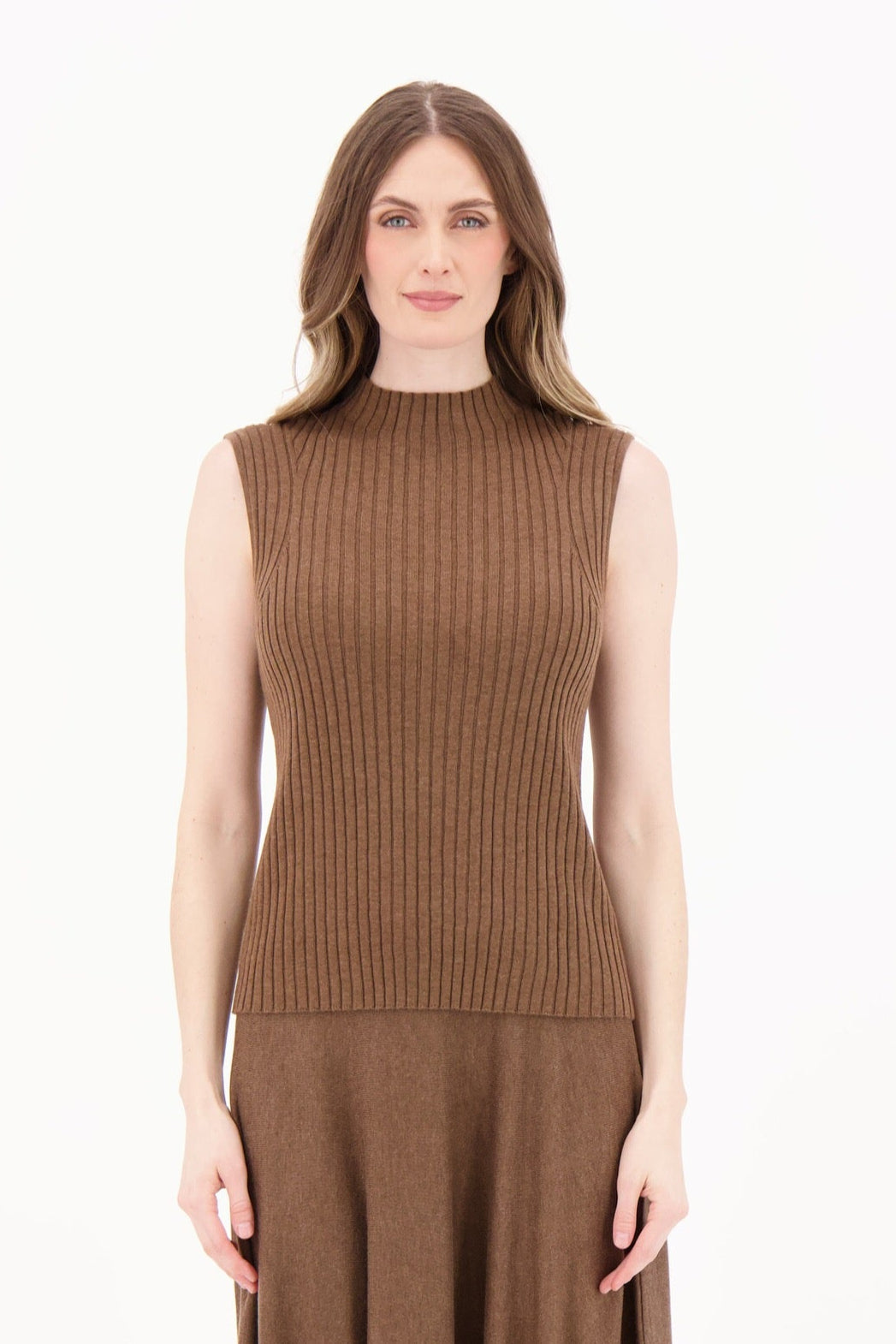 Woman wearing a brown sleeveless dress on a white background