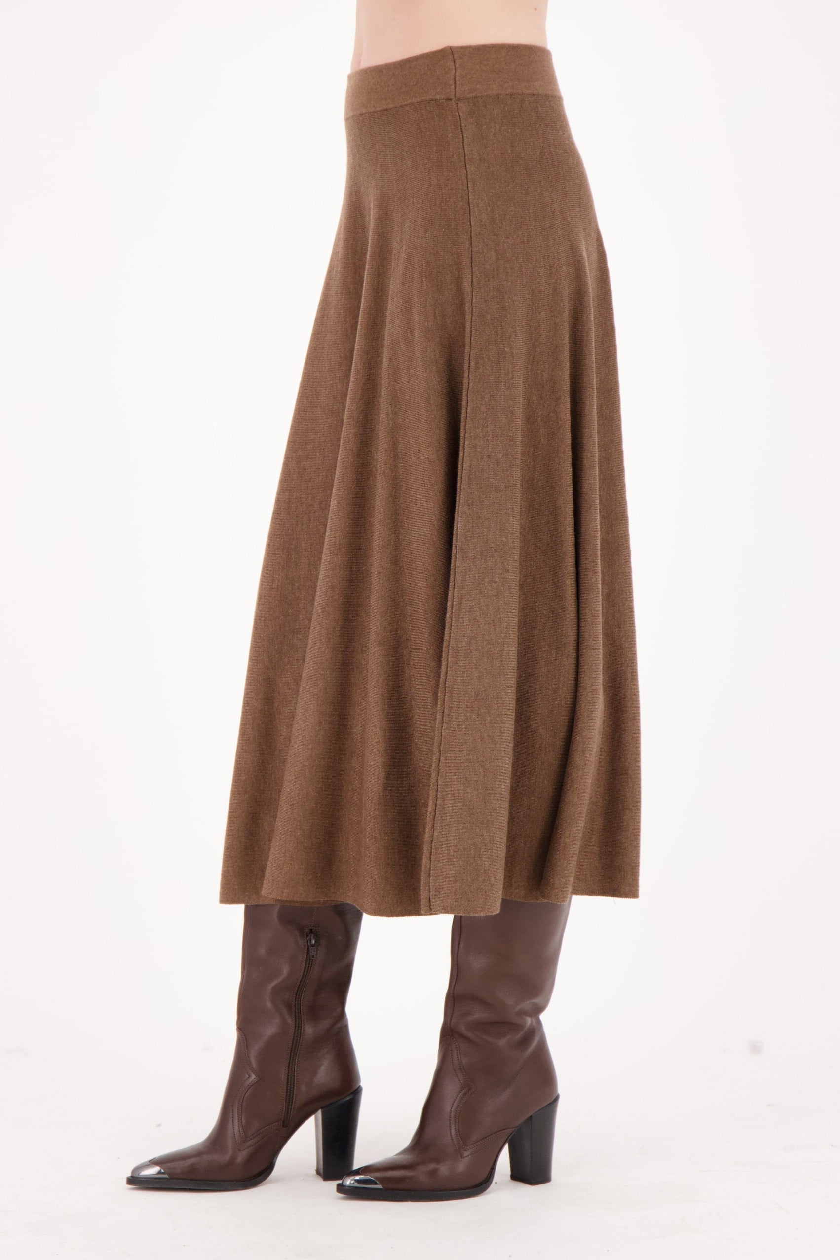 Brown skirt and boots on a white background