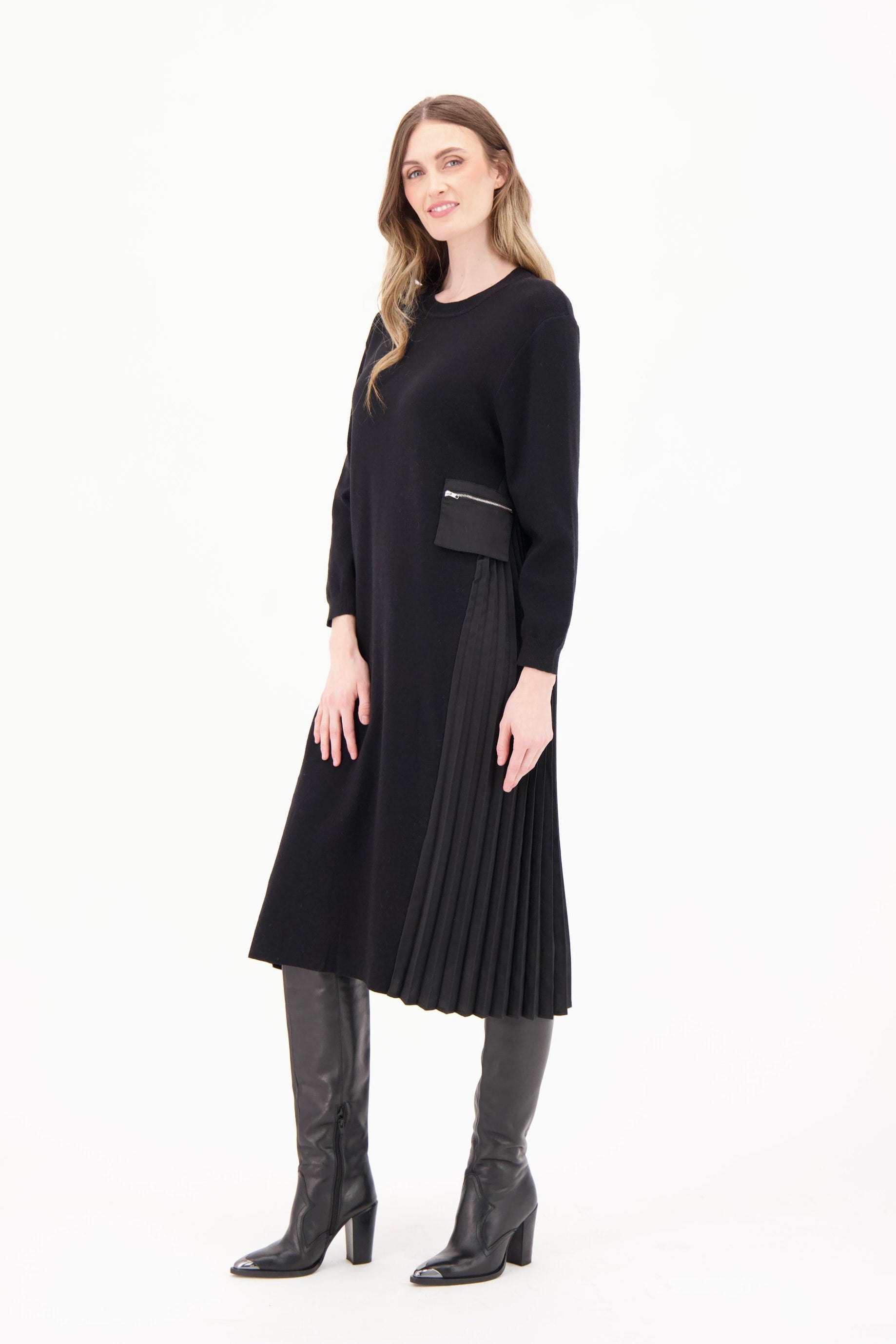 Woman wearing a black dress with a white background