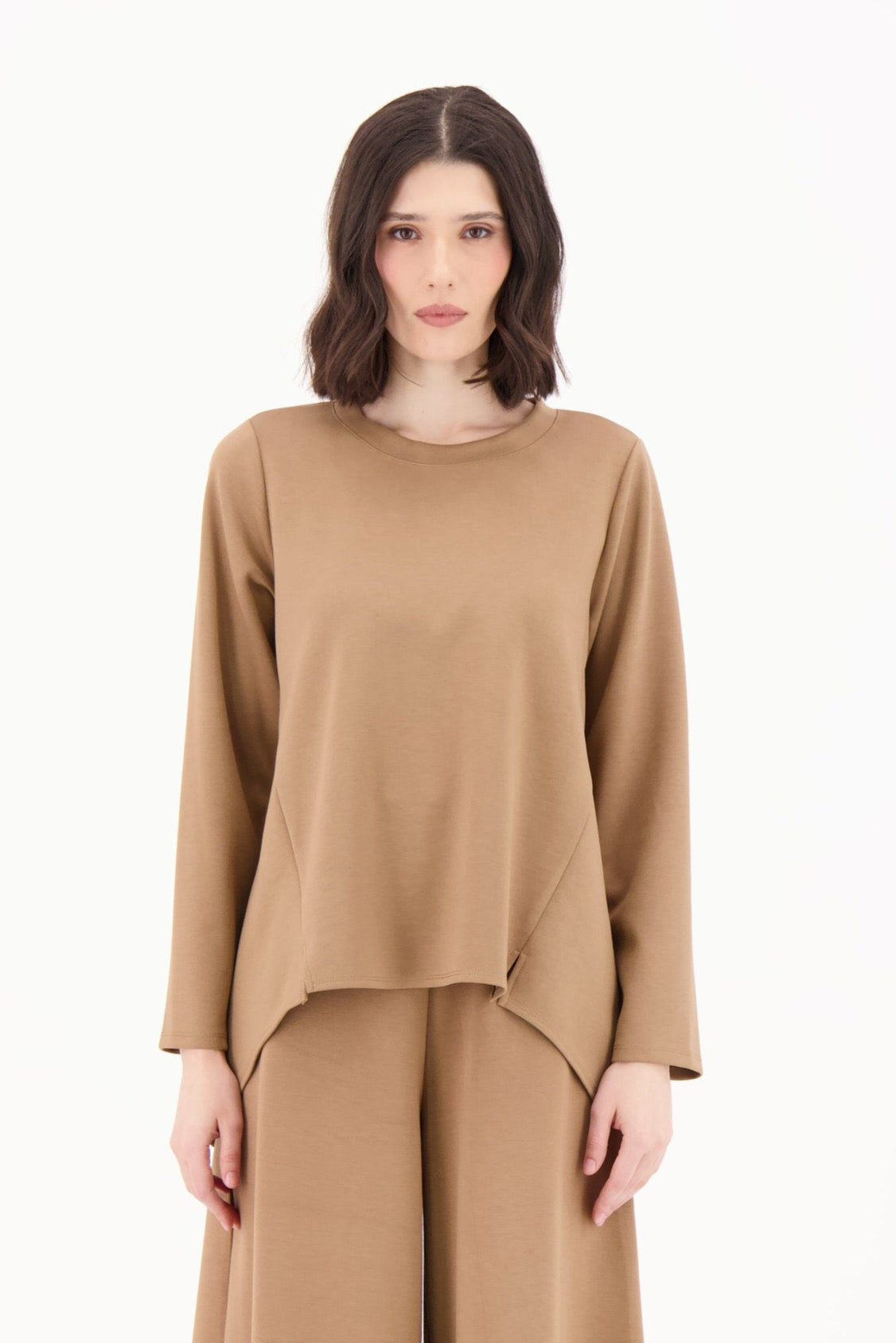 Woman wearing a brown outfit on a white background