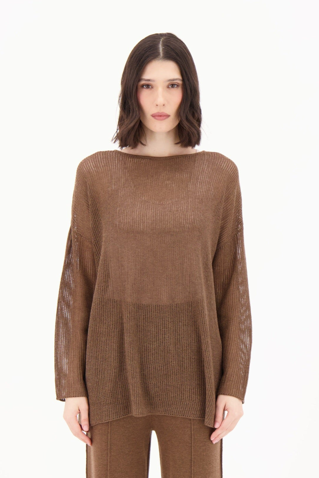 Woman wearing a brown outfit on a white background