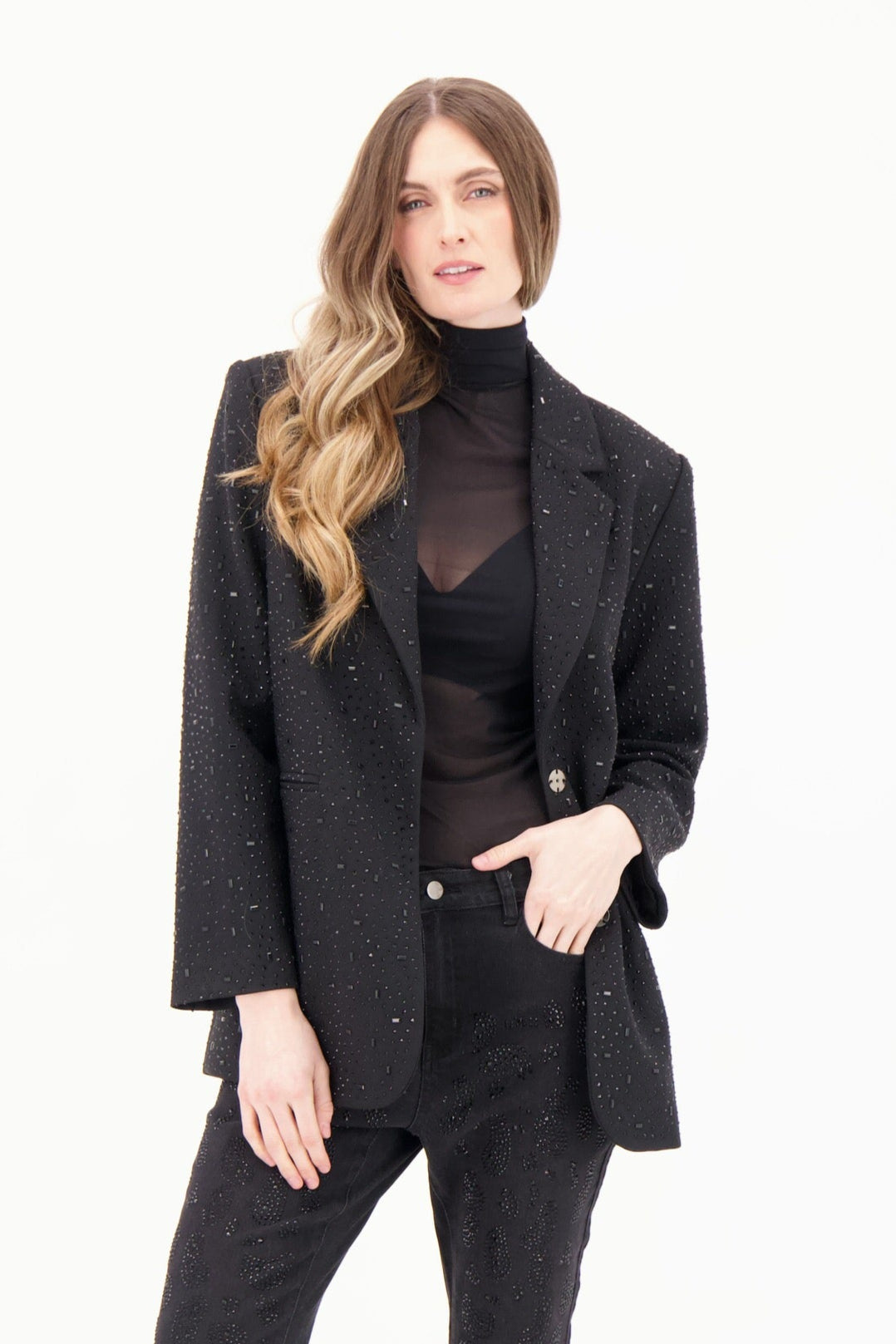 Woman wearing a black suit on a white background
