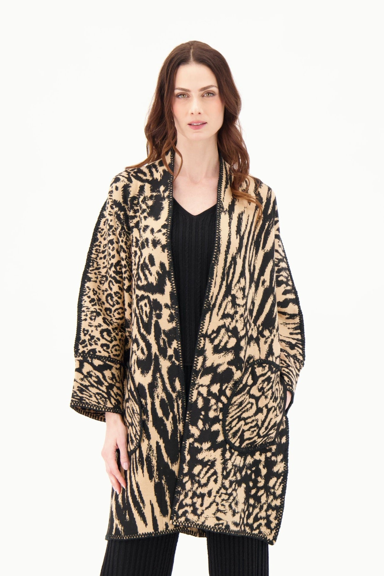 Woman wearing a leopard print coat on a white background