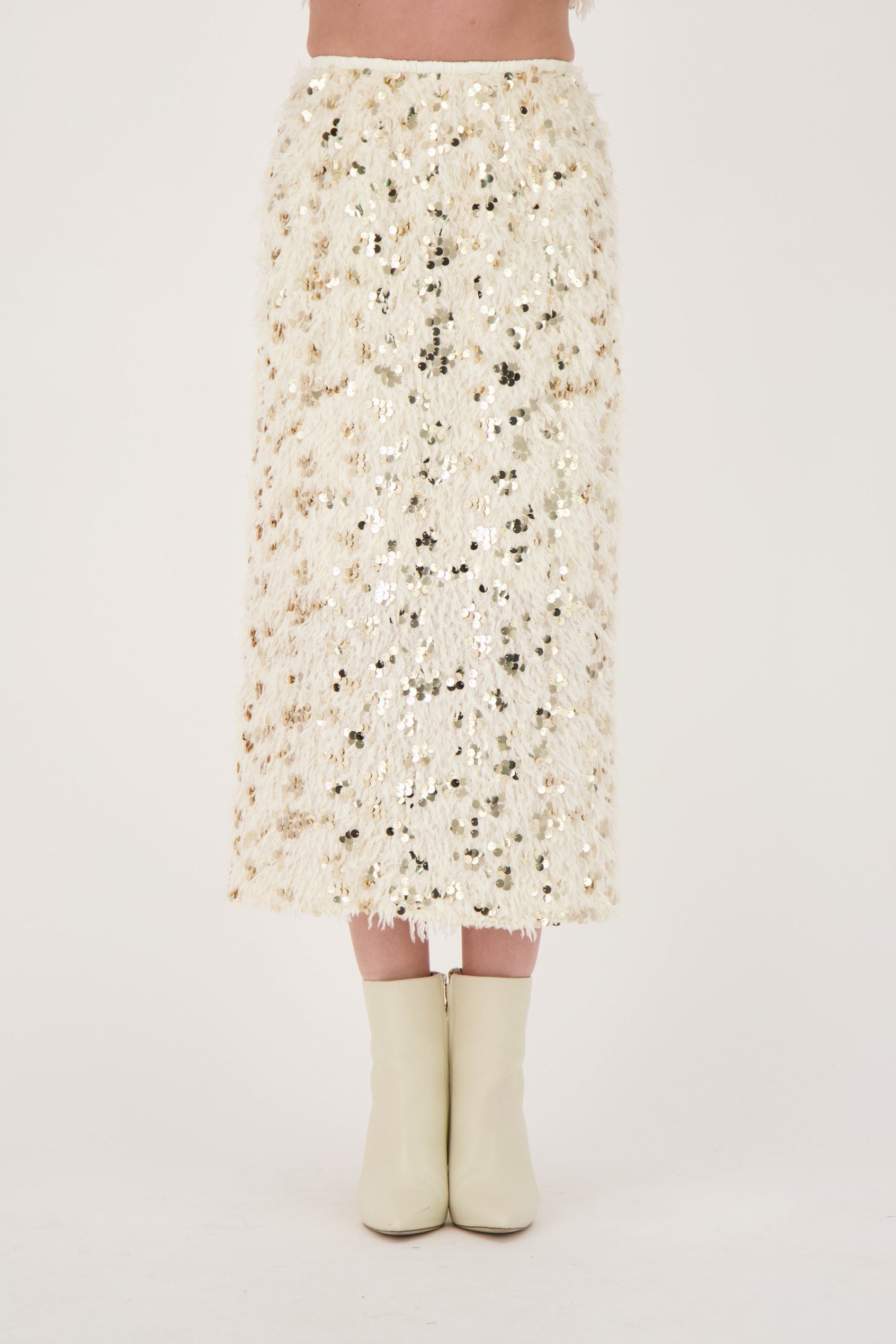 Person wearing a floral dress with a plain background