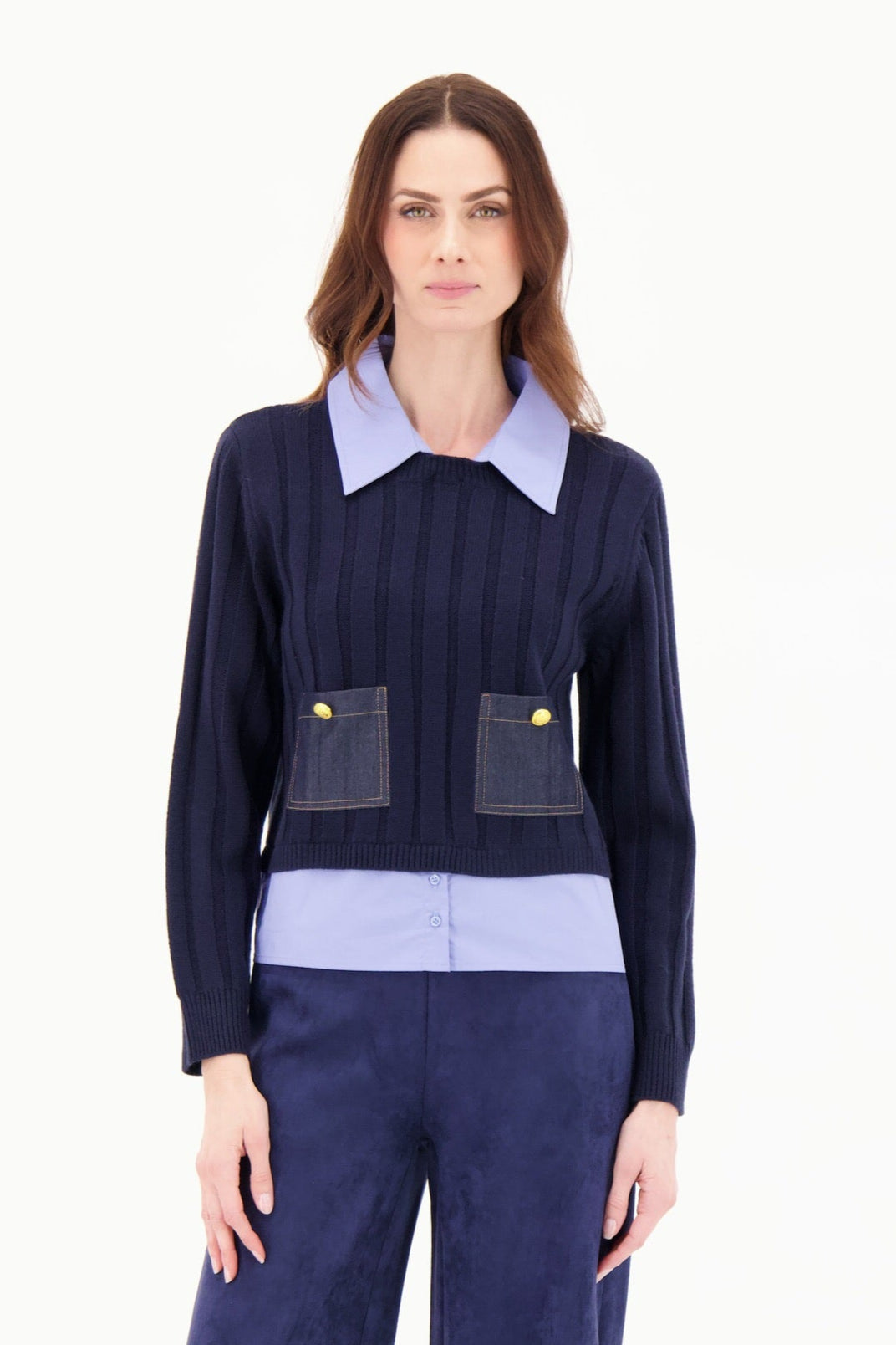 Woman wearing a navy blue outfit with a light purple shirt on a white background
